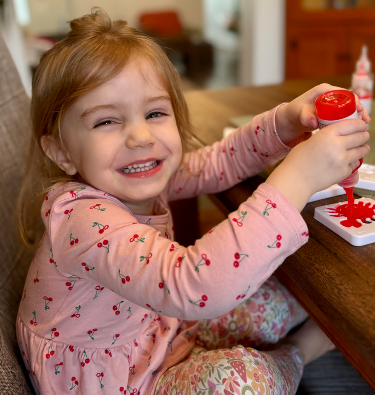 Child creating colorful squishy water elf figures with the Magic Water Elf kit